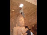 Atop the Buddha.