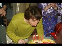 Jackie makes a wish and blows out the candles.