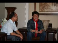 Jackie is welcomed by officials at Guizhou International Airport.