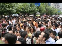 Crowds clog the streets outside the kindergarten complex.