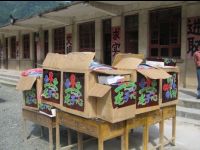 Warm coats and school supplies wait to be distributed to students.