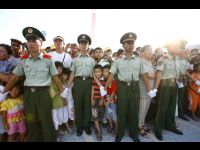 China police keep the crowds under control.