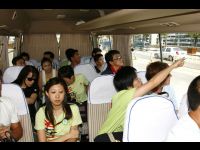 Jackie and his staff in the van on the way to the hotel.
