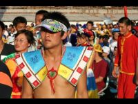 A tribe member wearing traditional clothing.