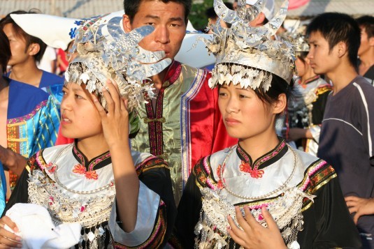 Tribe members wearing traditional clothing.