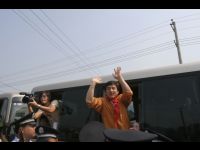 Jackie waves from the van.