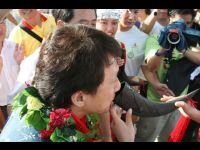 Jackie tastes the traditional wine which is offered as a greeting by one of the local people.