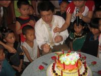 Jackie with the children at the group birthday party. Many of these children had never had a party or birthday cake.