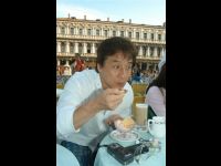 Jackie enjoys some ice cream in an outdoor cafe.