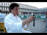 Checking out some photos on his digital camera.