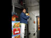 Going up the freight elevator at Yau Ma Tei fruit market.