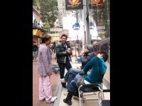 Jackie, Yuen Biao, Benny Chan, and Louis Koo chat during a break from filming in Central.