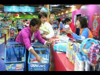 Louis and Jackie filming at Toys R Us.