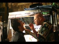 Tony the Medic checks Jackie's throat.
