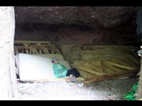 This guy is sleeping in a cave.