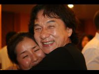 Hair stylist Ah Hui receives a bone-crushing hug from JC.