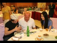 Michael Angarano, Crystal, and Michael's dad Mike look over the photo album from Jackie.
