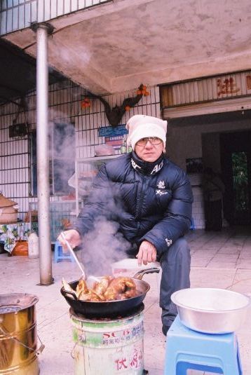Jackie cooks lunch on the set.