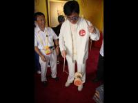 Jackie tries out a traditional toy at the China Story display (July 25, 2008)