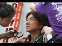 Makeup, hair, and wardrobe work together to get Jackie ready.