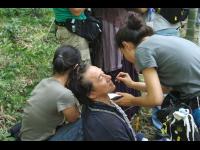 Jackie rests while makeup gets him ready for a scene in the bamboo forest.